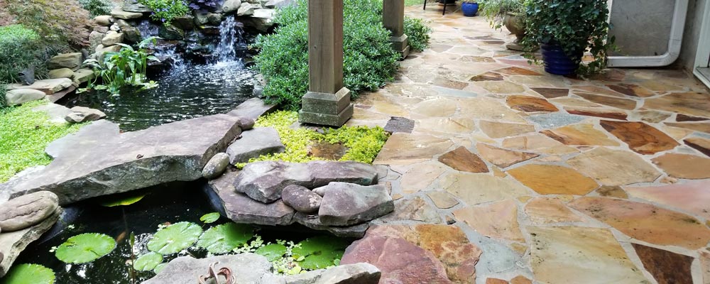 Irregular flagstone path after pressure washing, joints cleared (2018)