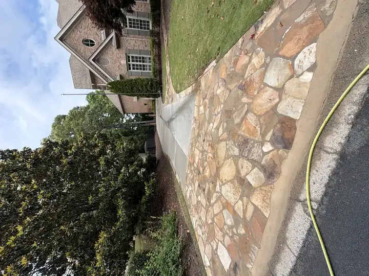Flagstone driveway apron and concrete driveway at a large brick home in Duluth, GA pressure washing job.