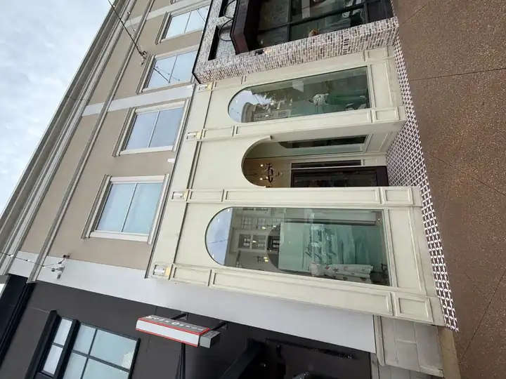 Full-width after shot of pressure-washed commercial building facade with arched windows in Alpharetta, GA