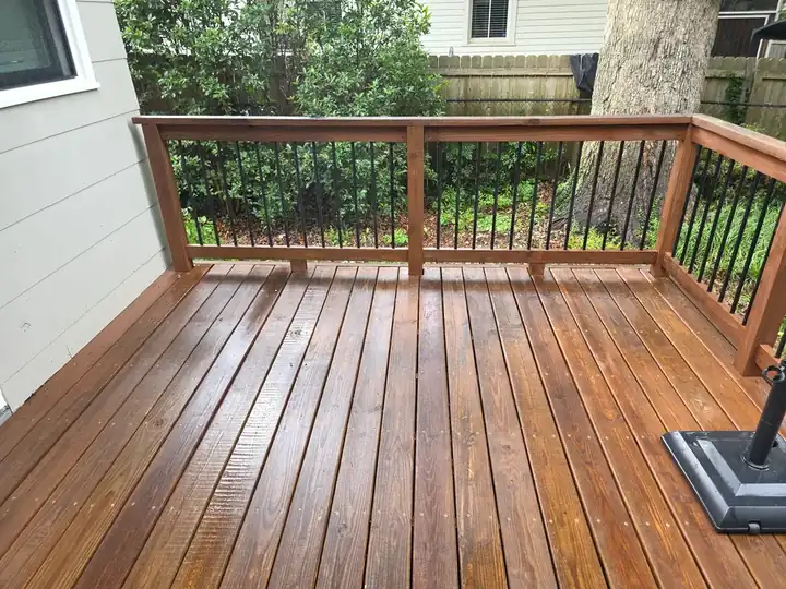 Freshly pressure-washed wood deck surface showing restored grain and color after cleaning in East Point, GA