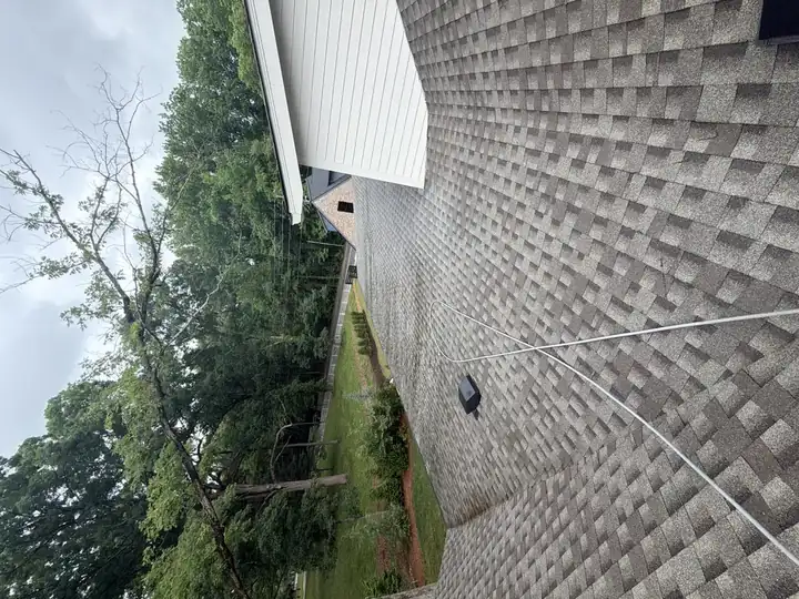 Clean rear asphalt shingle roof slope after soft wash cleaning on a residential home in Marietta, GA