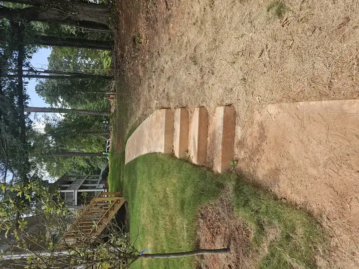 Concrete walkway with steps descending a slope at a new construction pressure washing job in Atlanta, GA.