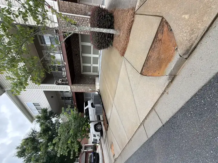 The driveway and garage door were fully washed clean. Some red Georgian clay staining is still present, but there is only so much you can do about that.