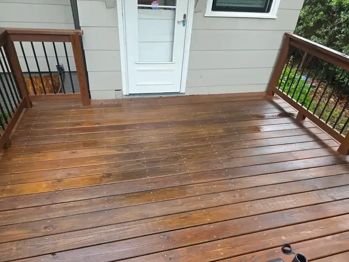 Clean wood deck boards showing restored grain after pressure washing at a residential home in East Point, GA
