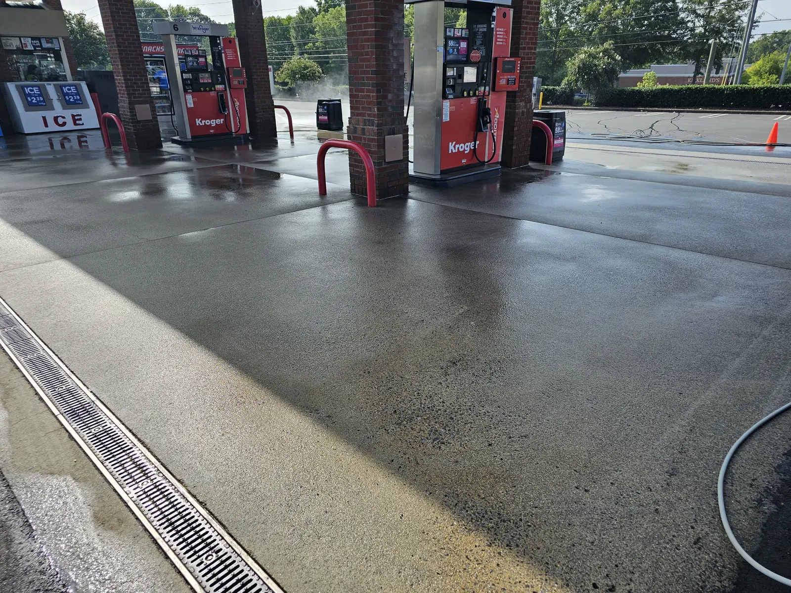 Kroger fuel station canopy and forecourt during a concrete wash, Dallas Highway, Due West, Cobb County, GA (Aug 2024)